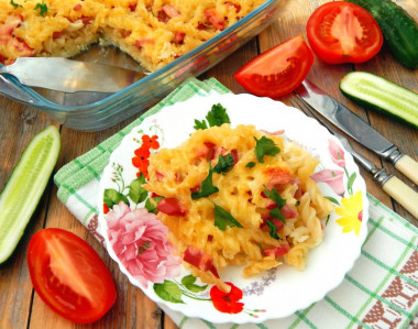 Pasta casserole with sausage and cheese in the oven