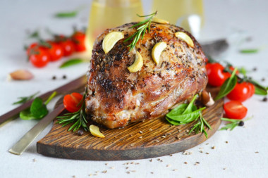 Baked pork shoulder in the oven in foil