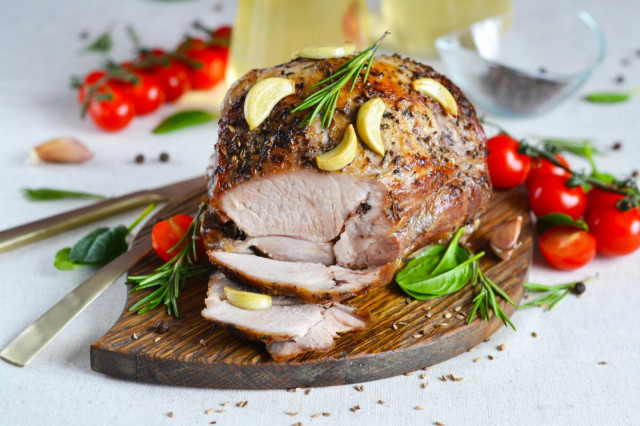 Baked pork shoulder in the oven in foil