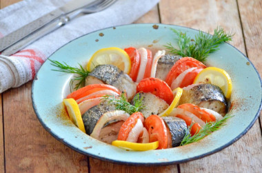 Mackerel with tomatoes baked in the oven with onions