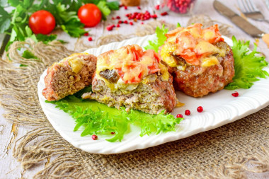 Minced meat nests stuffed with cheese and mushrooms in the oven