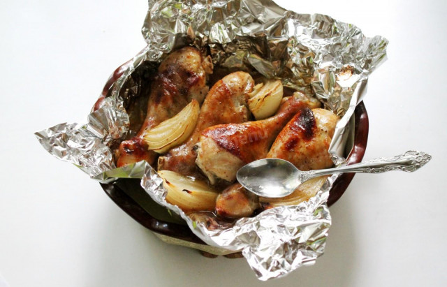 Baked chicken legs in foil in the oven