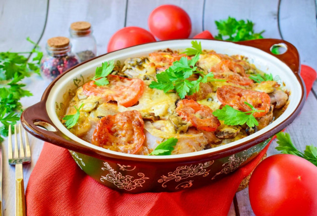 Chicken under a fur coat in the oven with potatoes and mushrooms