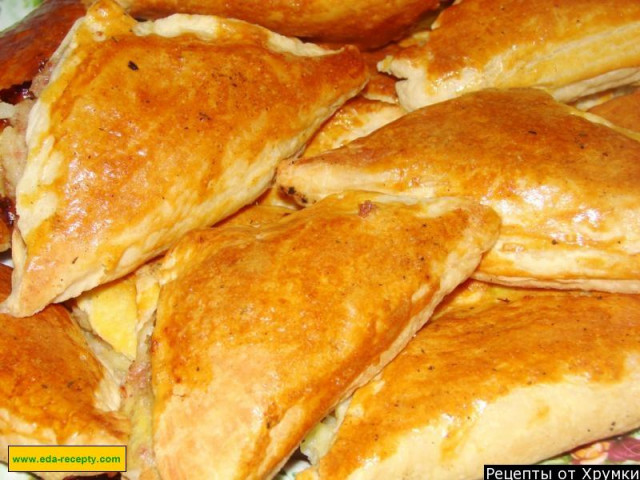 Puff pastry pies with cheese in the oven