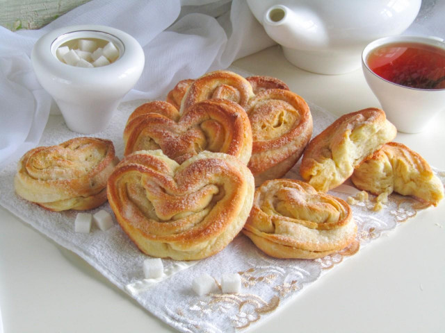 Pies with sugar from yeast dough in the oven