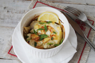 Fish baked in the oven with potatoes