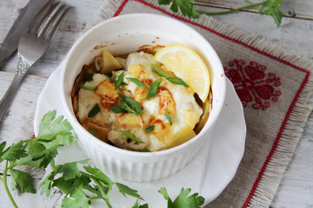 Fish baked in the oven with potatoes