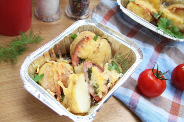 Potatoes with sausage and cheese in the oven