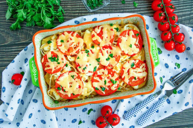 Potatoes in the oven with mayonnaise and tomatoes
