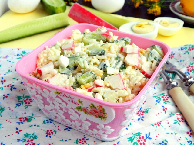 Salad with rice, crab sticks, cucumber and corn