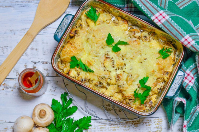 Chicken legs with mushrooms in the oven