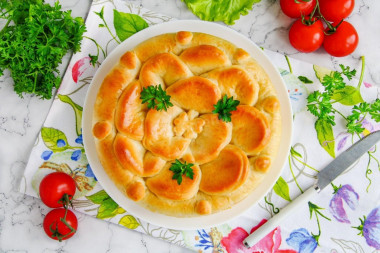 Yeast pie with fresh cabbage in the oven