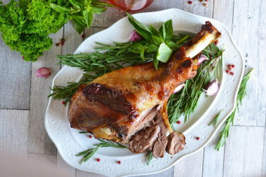 Juicy and soft turkey drumstick in cream in oven