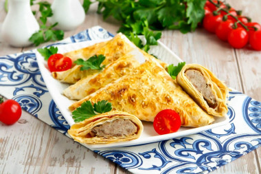 Pita bread samsa with minced meat in the oven