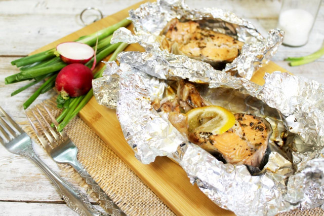 Salmon steak in foil in the oven