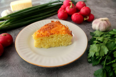 Raw potato casserole with cheese in the oven