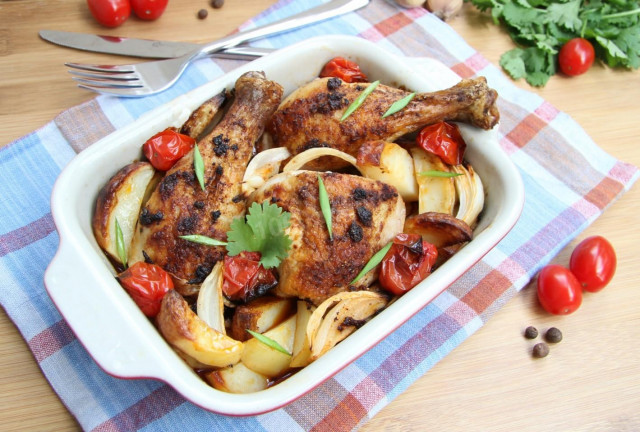 Chicken drumsticks with vegetables in the oven