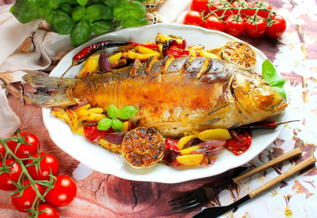 Carp baked in the oven with vegetables