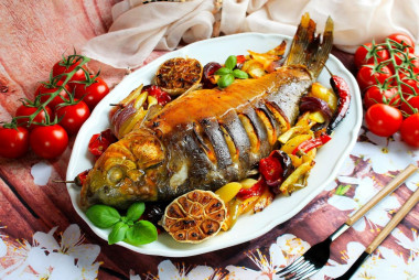 Carp baked in the oven with vegetables