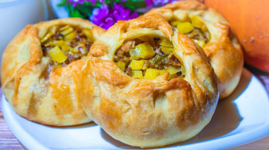 Minced meat and potato pies in the oven