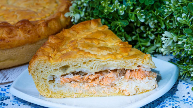 Fish pie with trout from yeast dough in the oven