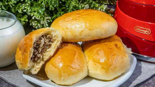 Pies with rice and minced meat in the oven