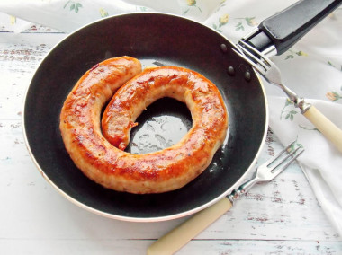 Homemade sausage fried in a pan