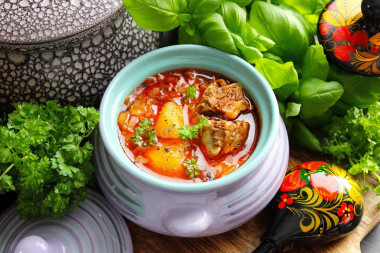 Cabbage soup from sauerkraut in the oven in a pot