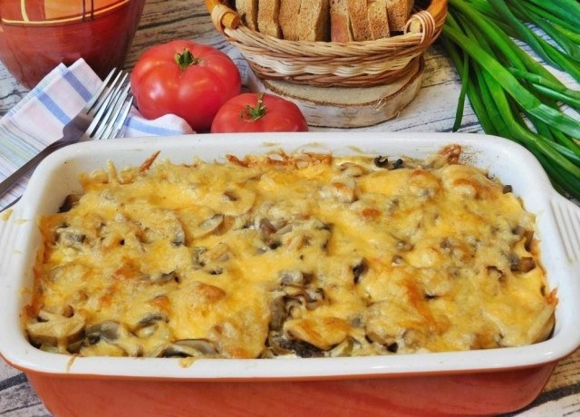 Chicken with potatoes and mushrooms in layers in the oven