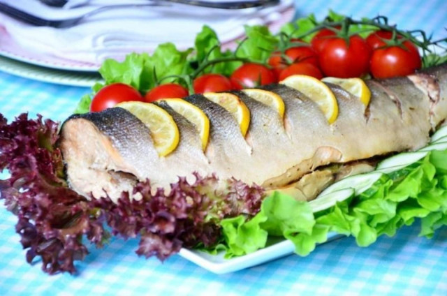 Pink salmon baked with lemon in the oven in foil