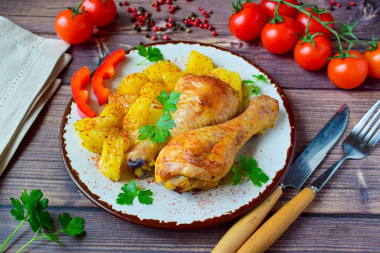 Drumsticks with potatoes in the oven with mayonnaise