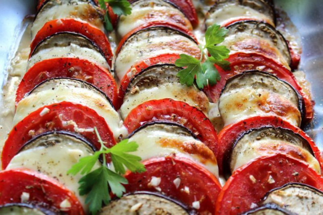 Eggplant casserole with tomatoes and cheese in the oven