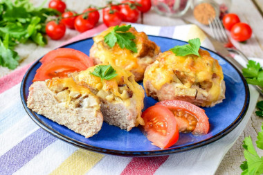 Stacks of minced mushrooms with cheese in the oven