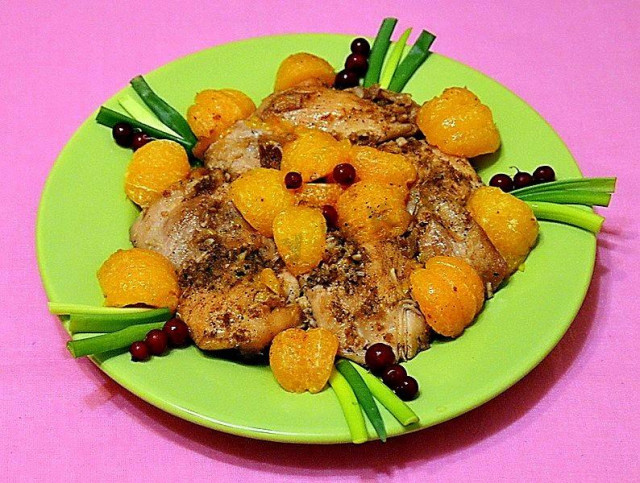 Chicken with tangerines in the oven