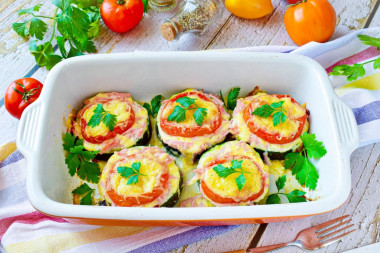 Zucchini with sausage and cheese with tomatoes in the oven