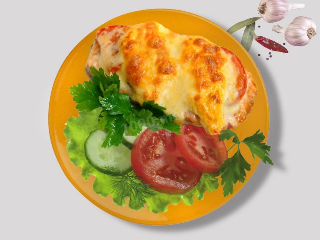 Cod fillet in the oven with cheese and tomatoes