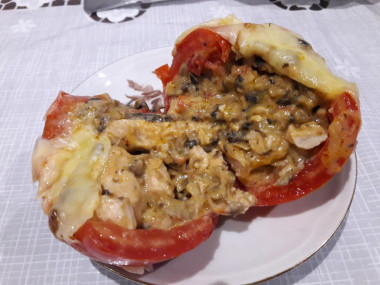 Tomatoes stuffed with chicken and cheese in the oven