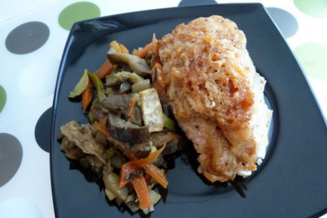 Salmon baked with vegetables in the oven