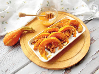 Honey Dessert made of pumpkin pieces baked in the oven