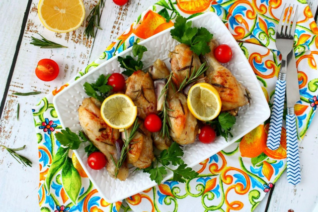 Chicken drumsticks with lemon oil and rosemary in the oven