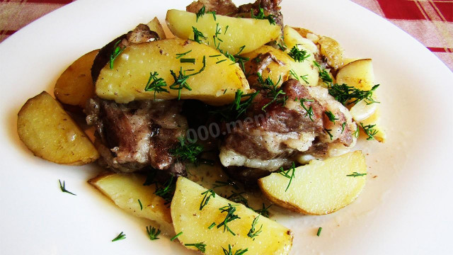 Pork ribs with new potatoes in the oven