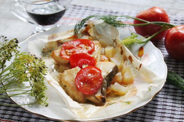 Cod fillet with zucchini onion tomatoes in the oven