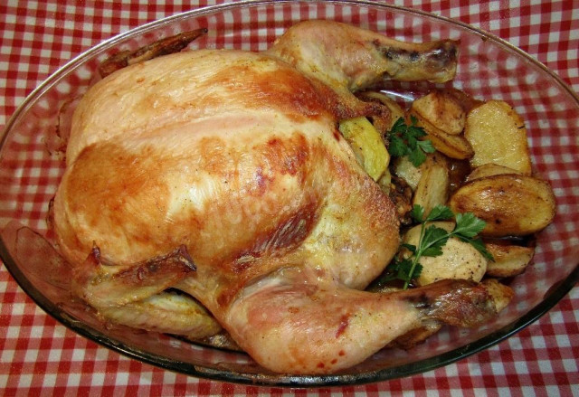 Chicken, baked with potatoes and seasoning Maggi in the oven