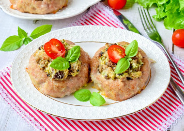 Nests with minced meat in the oven with mushrooms