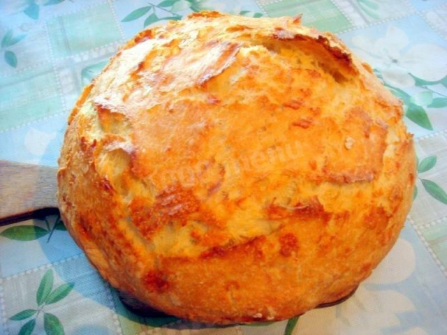 Homemade bread with dry yeast and hard cheese in the oven