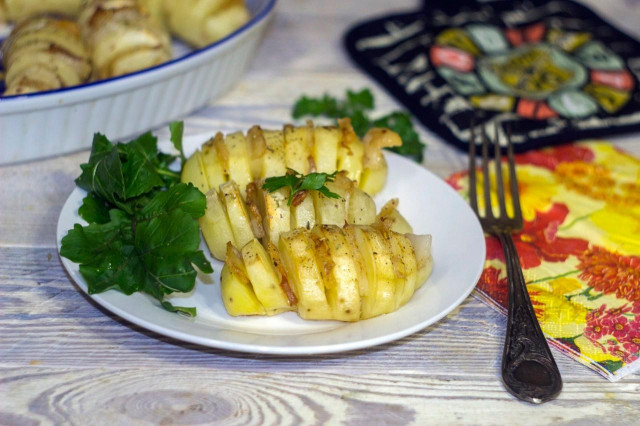 Accordion potatoes with bacon in the oven