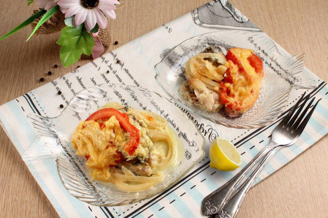 Hake in foil with tomatoes and cheese in the oven