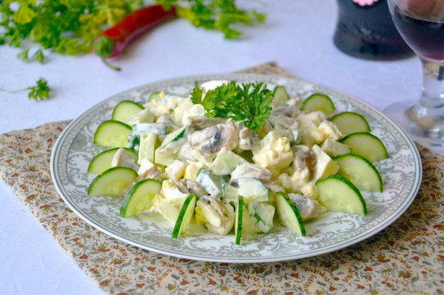 Salad with fried mushrooms, cucumbers and eggs