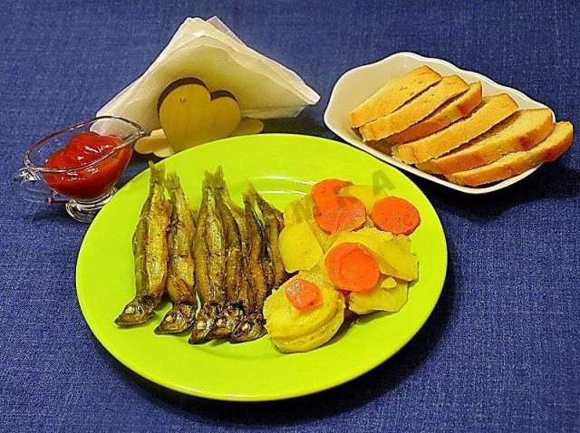 Capelin with potatoes in the oven