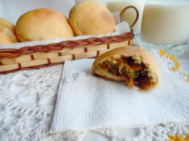 Yeast pies with cabbage and egg in the oven